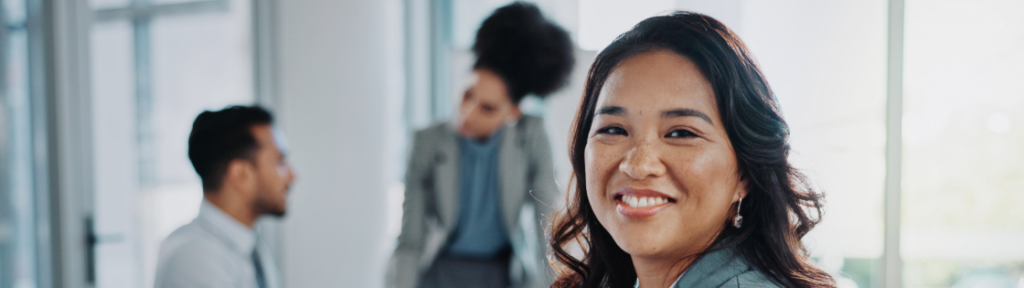 female office working facing us with a big smile.