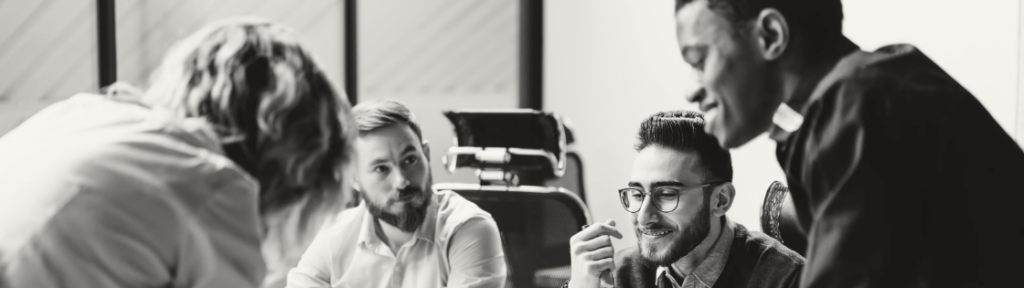 Group of four men talking